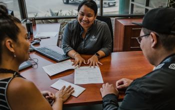 A couple meeting with a Gather representative in office